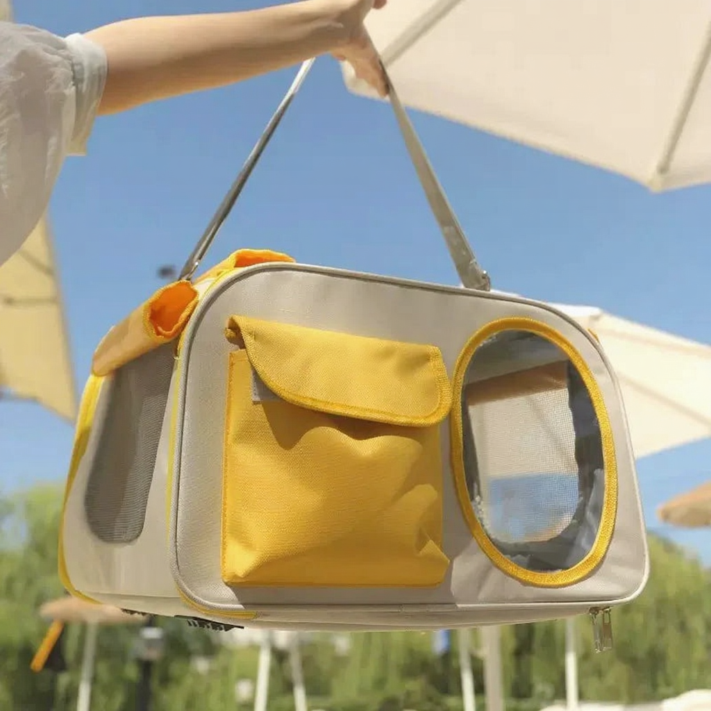Breathable Capsule Pet Carrier Backpack - Image 7|||PROMPT|||Cleaned image. Original analysis: Found 1 brand name printed directly on the product - 'LOVE PET' text visible on the yellow fabric pocket of the pet carrier
