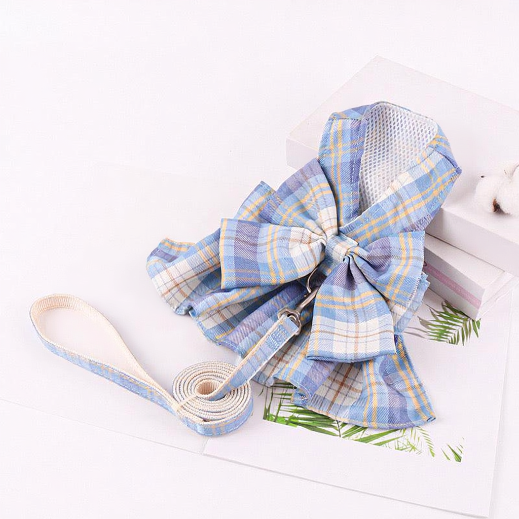 Catvera Bow Tie Cat Harness Set - Image 2|||PROMPT|||Cleaned image. Original analysis: Found text branding on the white documents/packaging in the background that appear to contain brand names and product information