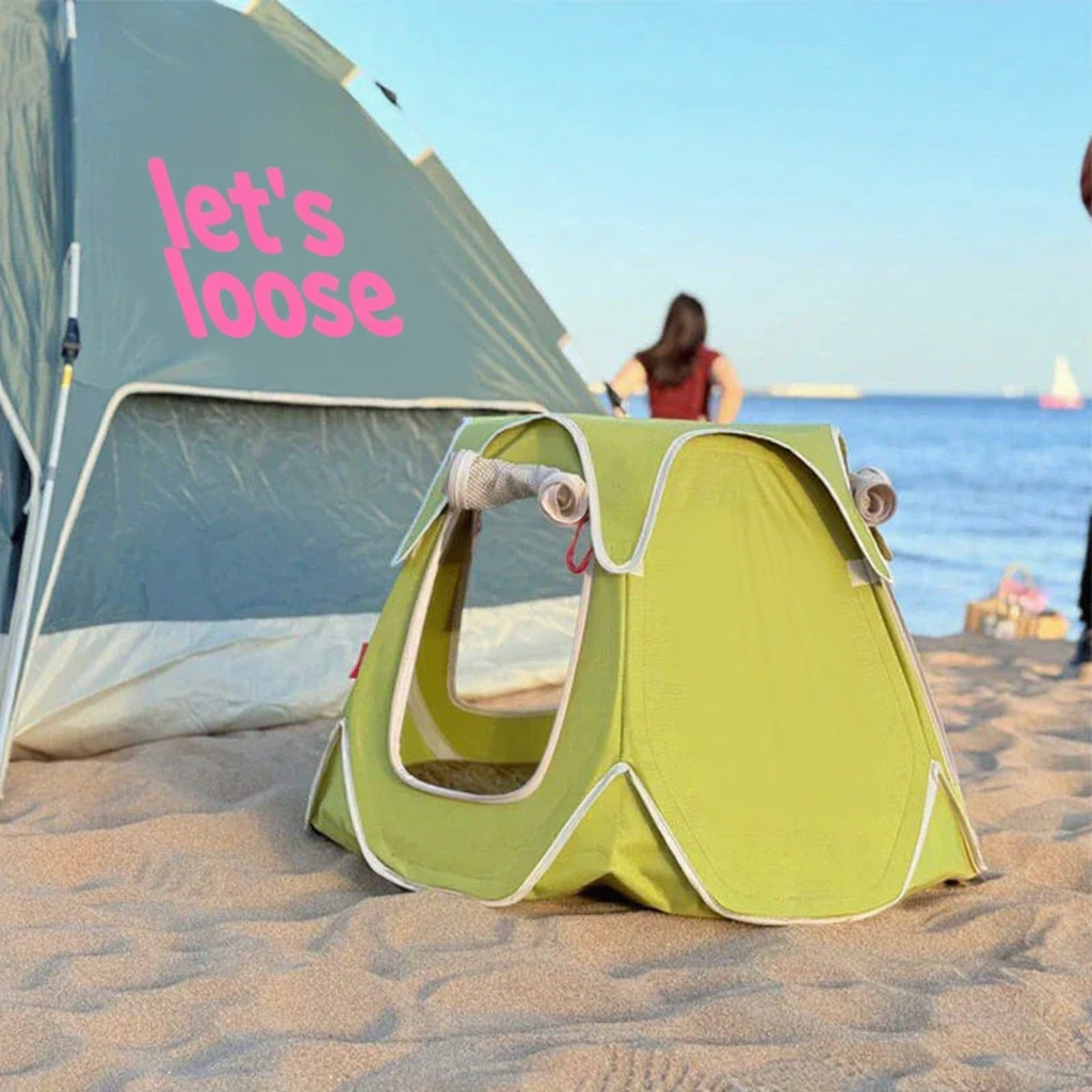 Catvera Foldable Outdoor Cat Tent - Image 10|||PROMPT|||Cleaned image. Original analysis: Found text/branding on the large tent/kite in the background that reads 'let's loose' and contains decorative pink elements and text that appears to include branding or messaging