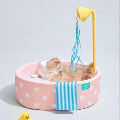 Catvera Japanese Hot Spring Cat Bed - Image 13|||PROMPT|||Cleaned image. Original analysis: Found 1 brand name/logo on the product - a small brand label/tag visible on the side of the pink bed where the blue striped fabric attaches