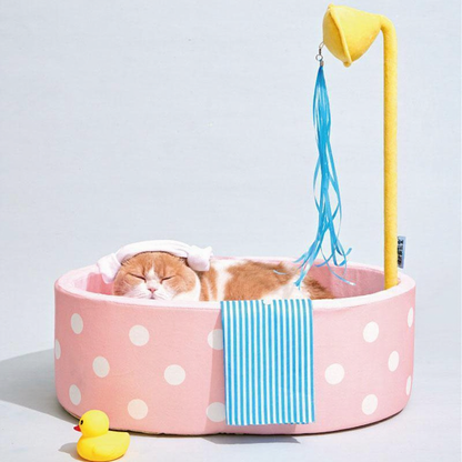 Catvera Japanese Hot Spring Cat Bed - Image 3|||PROMPT|||Cleaned image. Original analysis: Found 1 brand name/watermark on the product - visible text on the blue striped fabric/toy attachment on the right side of the cat bed