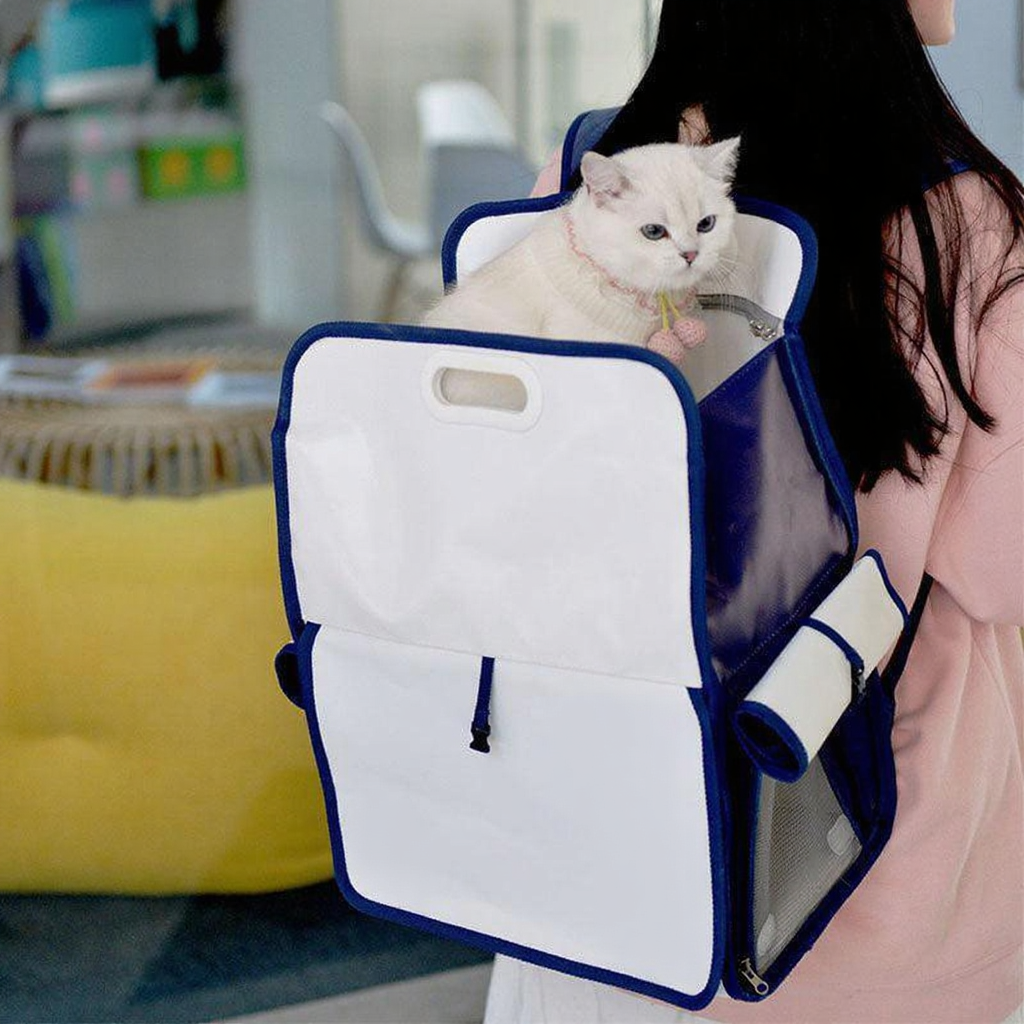 Catvera Milk Carton Cat Carrier - Image 3|||PROMPT|||Cleaned image. Original analysis: Found 1 brand name printed directly on the pet carrier backpack fabric