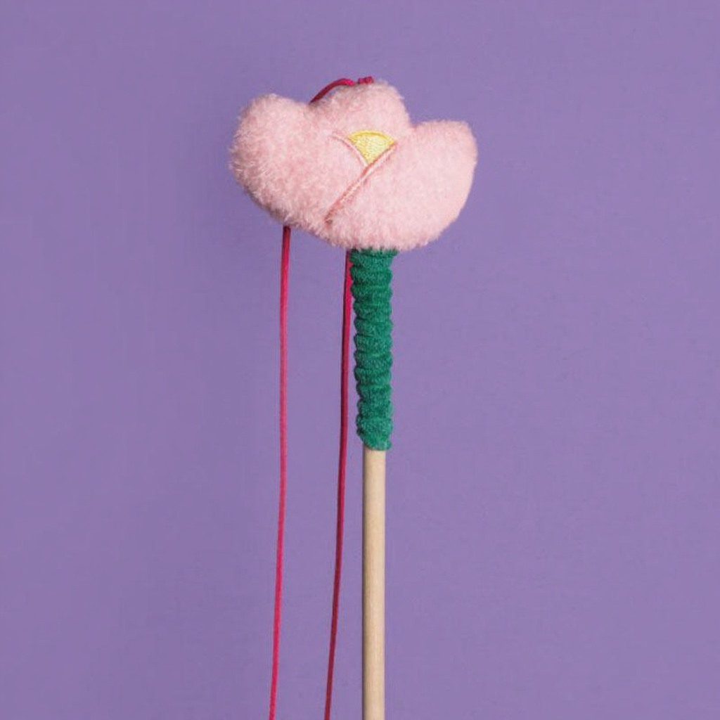 Catvera Wooden Bell Cat Stick - Image 1|||PROMPT|||Cleaned image. Original analysis: Found 1 product tag with caution label and branding on the right side of the plush flower toy